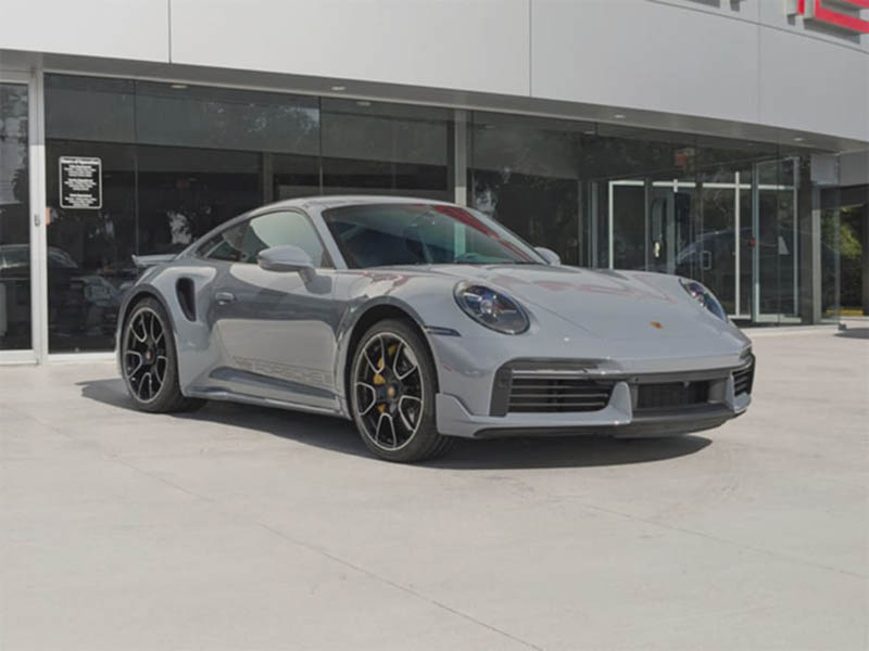 Original silver Porsche photographed on the lot.