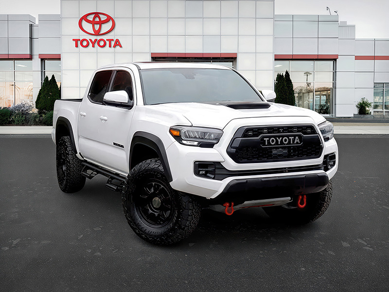 The same Toyota pickup in a branded dealership setting.
